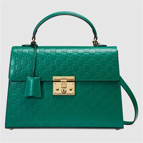 gucci green travel bag|Gucci official website.